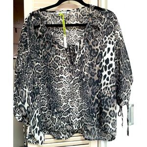 ANIMAL PRINT TOP SEMI SHEER PEEKABOO CUT OUT WITH STRING TIE TOP DOLMAN SLEEVES